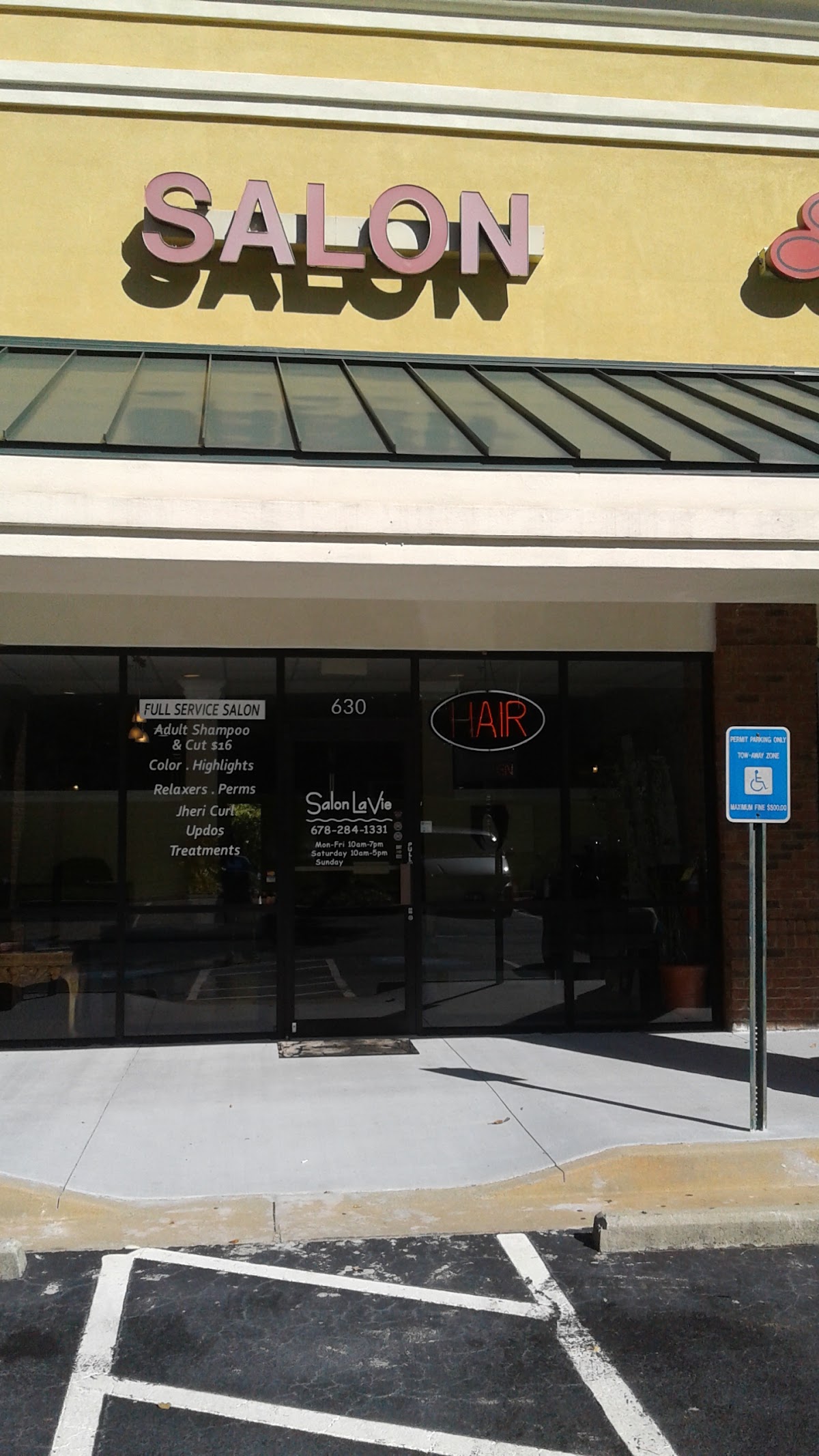 The Salon La Vie storefront sign in the Eagles Landing shopping center