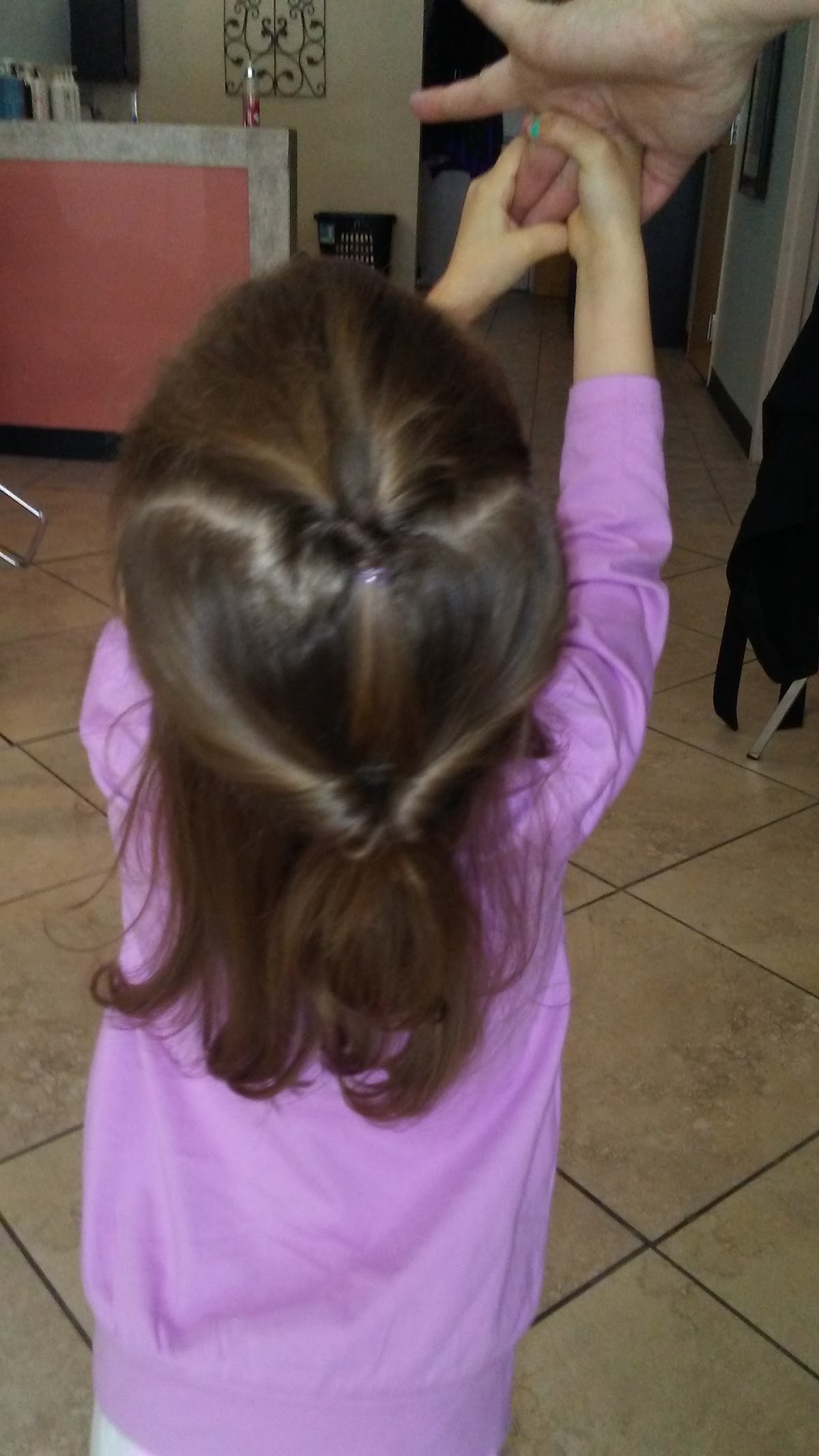 A playful heart-shaped style created for a young client at Salon La Vie
